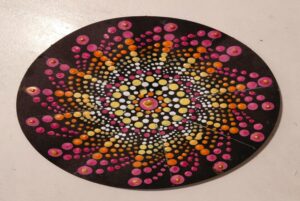 A circular painted surface with colorful dots AI-generated content may be incorrect.