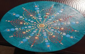 A painted blue circle with red and blue dots on it AI-generated content may be incorrect.