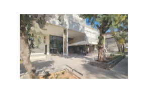 A building with trees and a walkway AI-generated content may be incorrect.